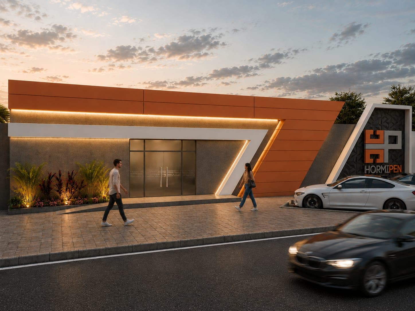 Fachada corporativa de Hormipen en paneles naranja y concreto