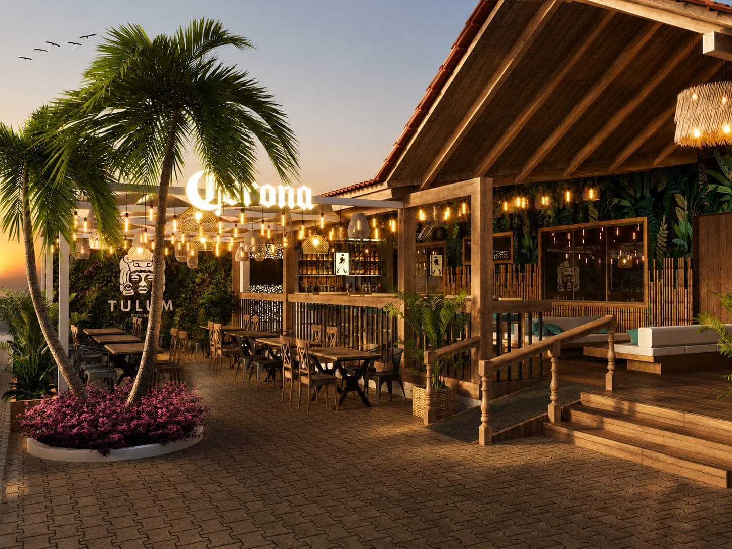Terraza de Tulum con palmeras, luces cálidas y mobiliario de madera al atardecer
